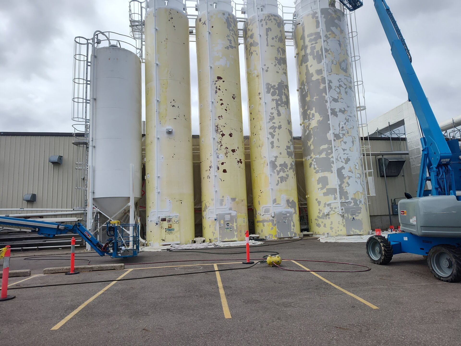 Chemical plant storage tanks — exterior repaint with industrial coating system