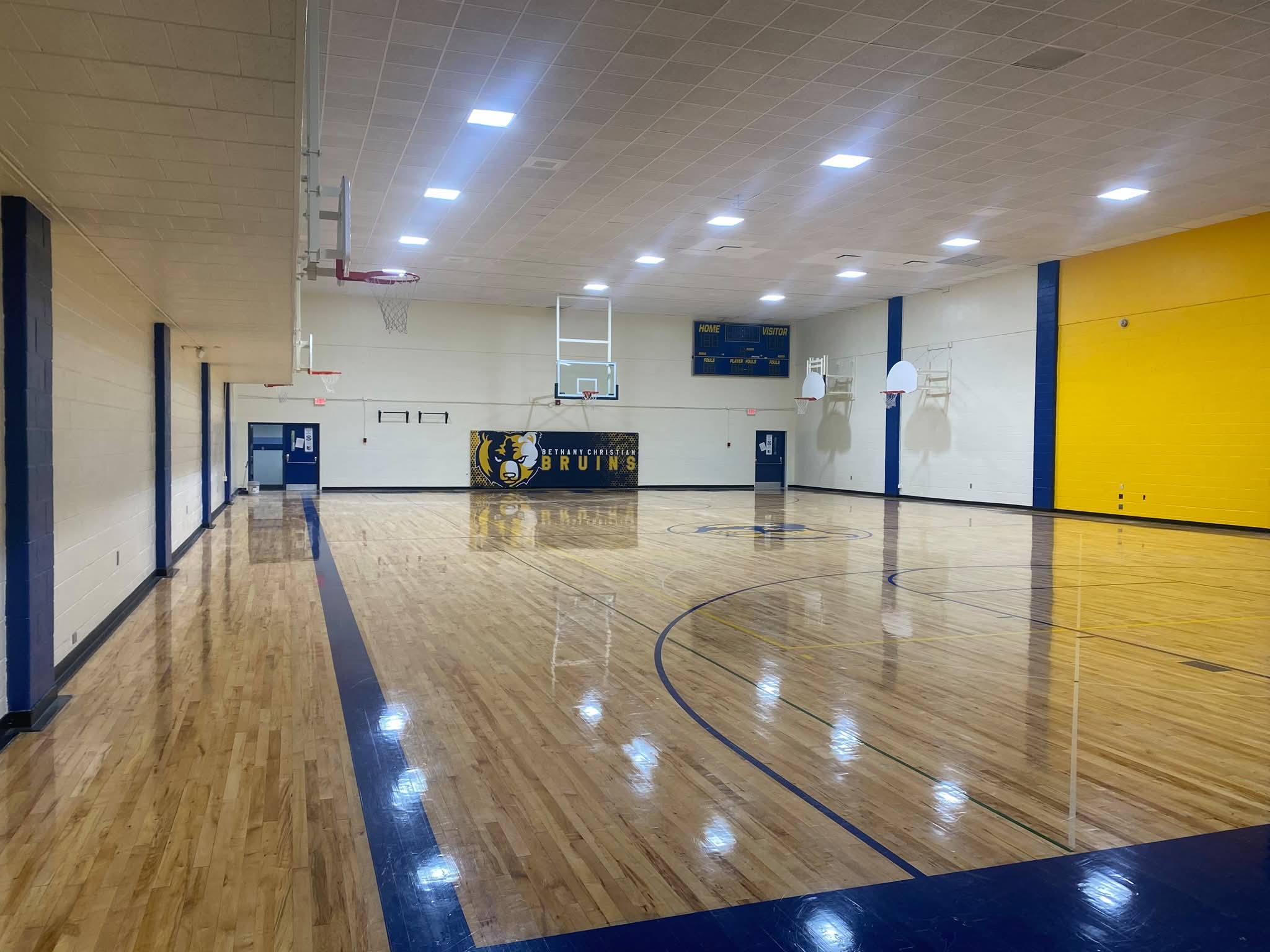 Wide angle — Bruins banner and completed gymnasium paint
