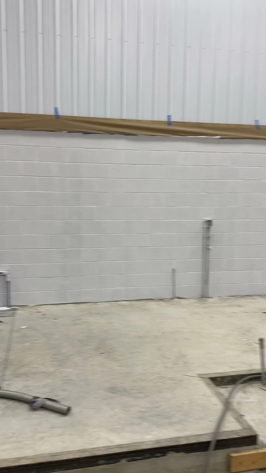 New construction CMU block wall — smooth sealed finish after block fill application