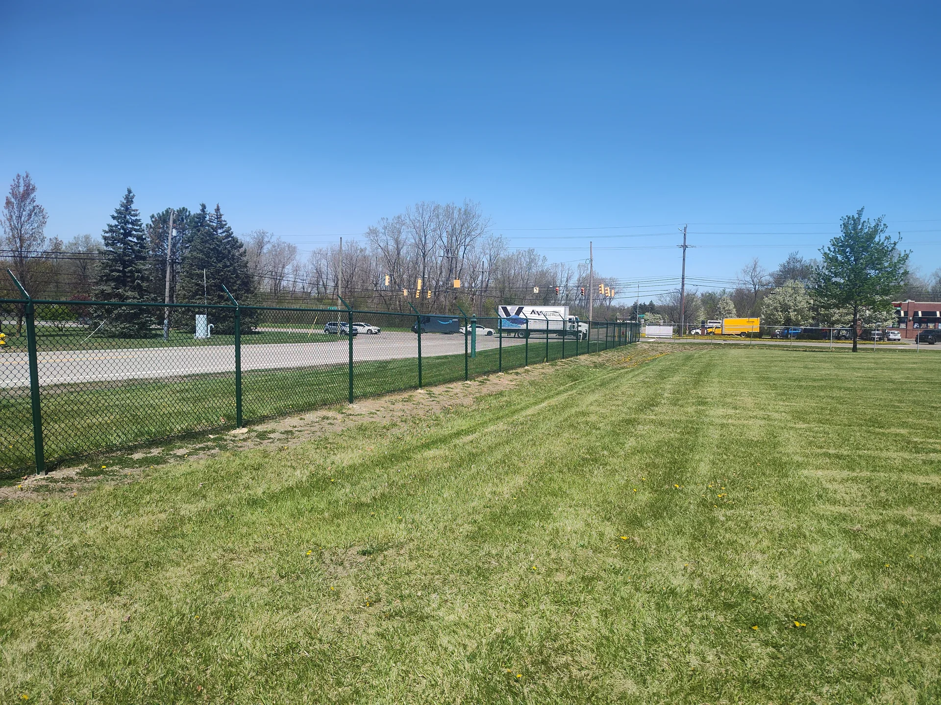 Brownstone fence — freshly power washed and repainted