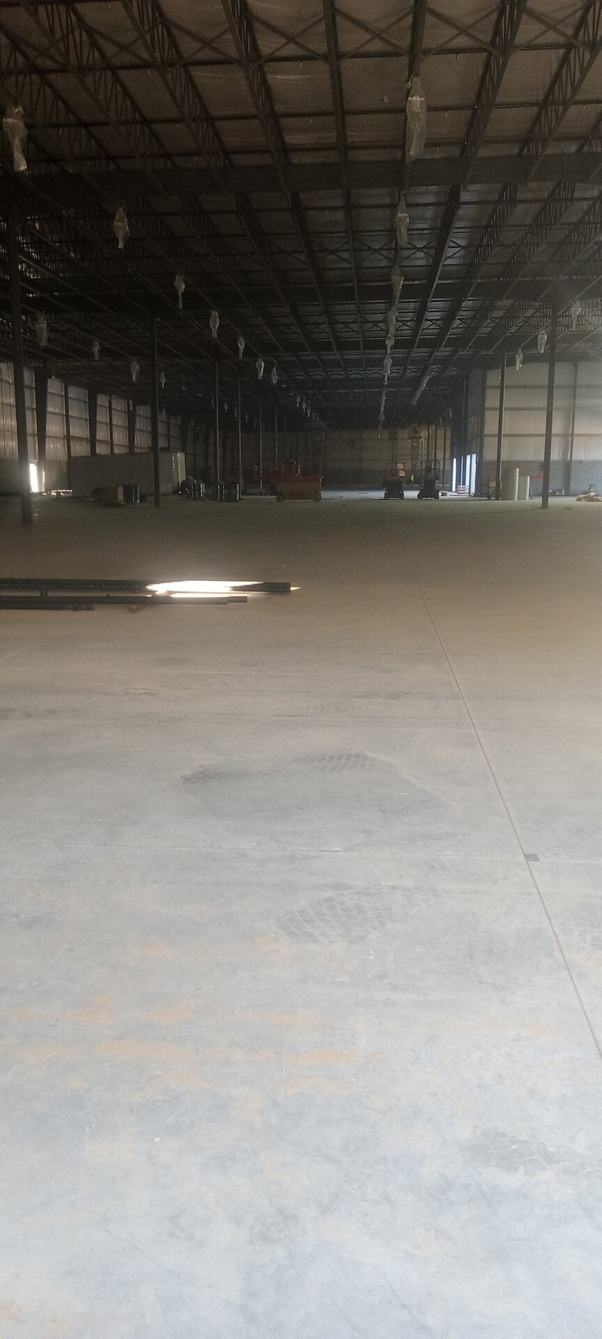 Export shipping facility before painting — raw steel structure and concrete floor