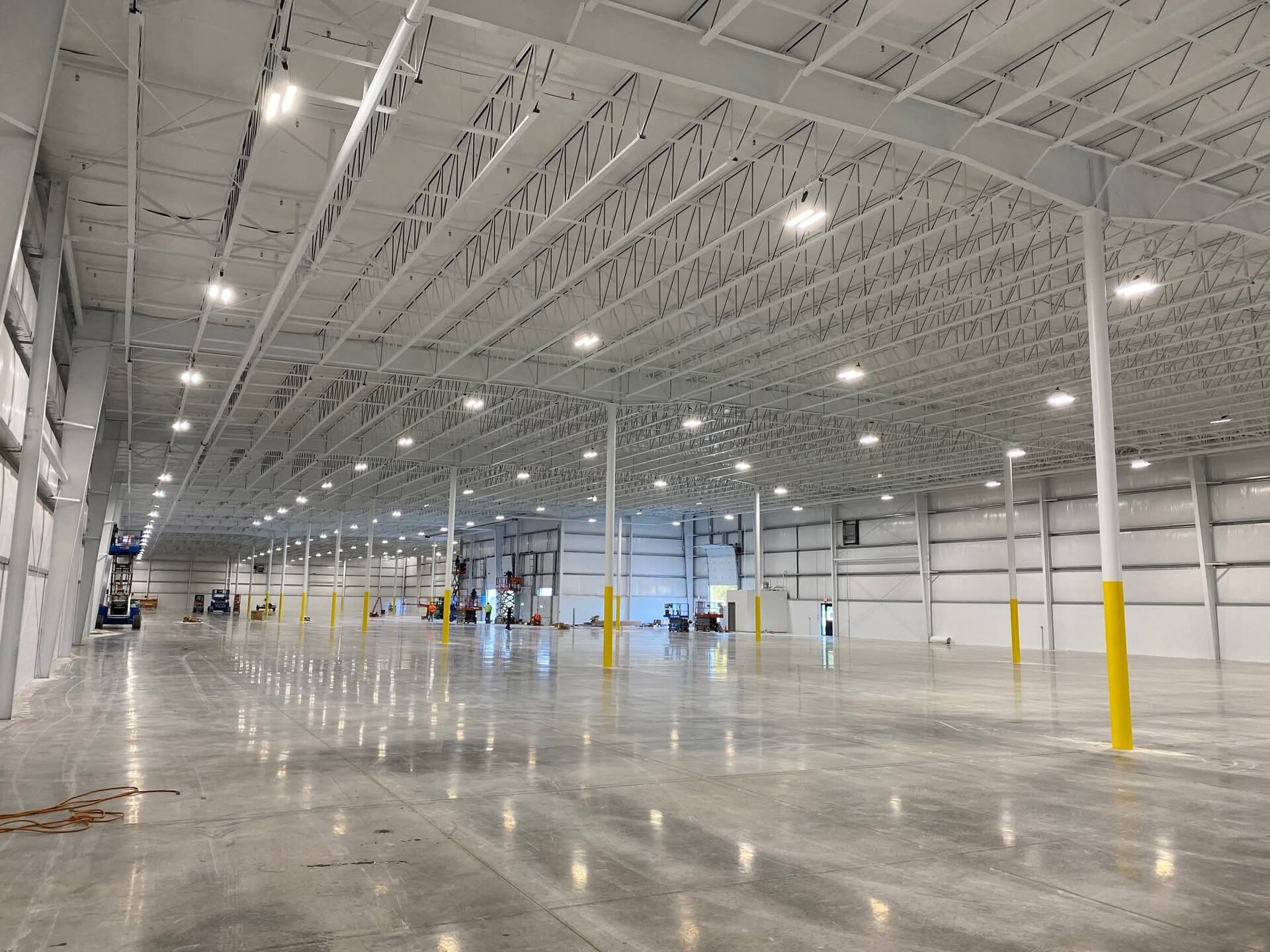 Export shipping facility new construction — completed interior with white painted steel structure