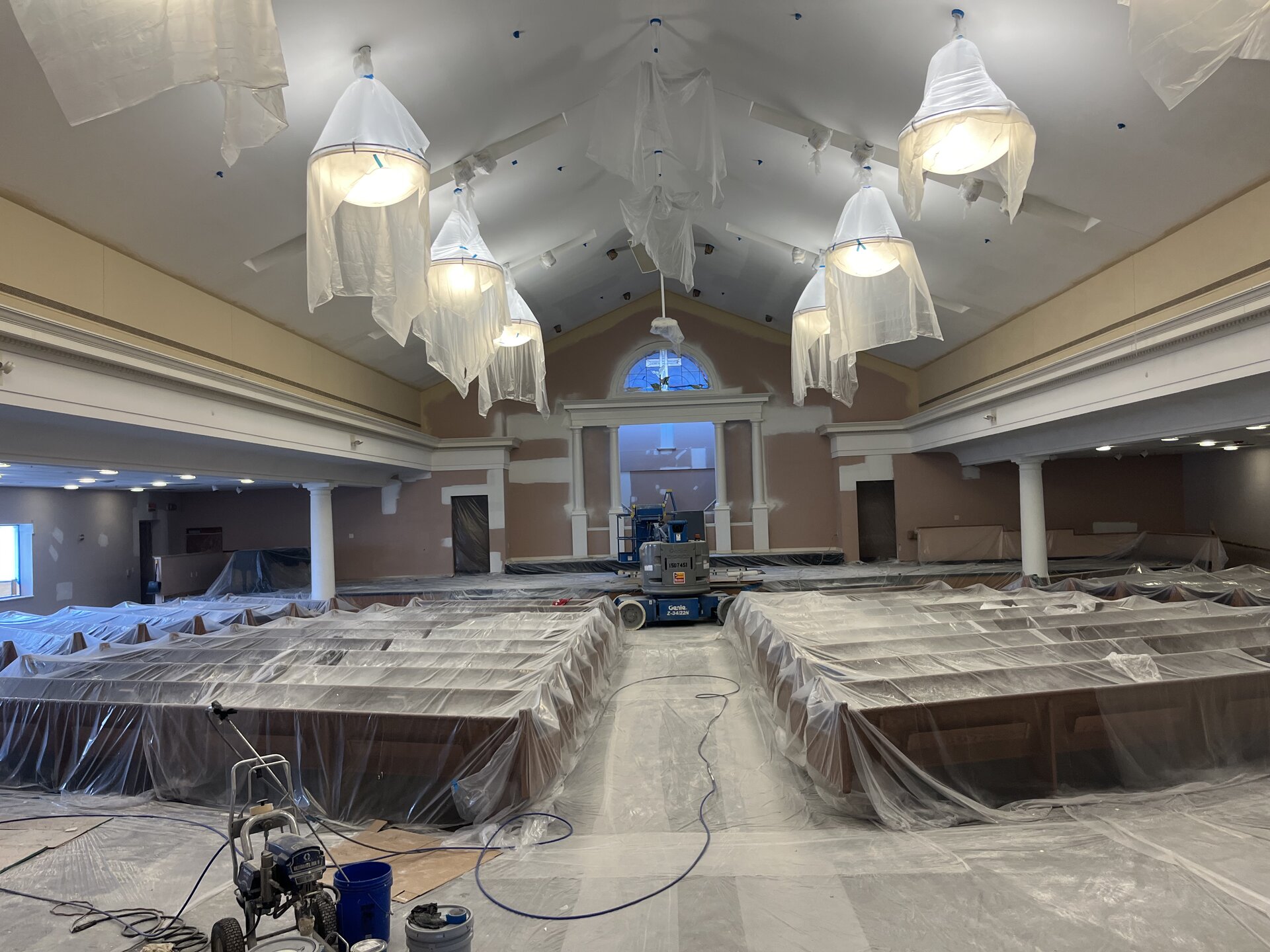 Auditorium painting progress — mid-project overview