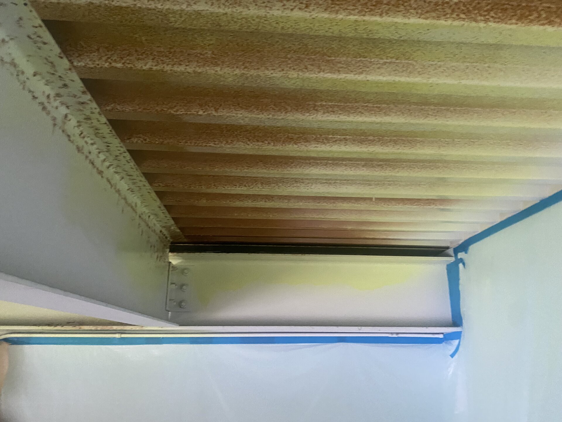 Swim school common area — repainted walls and ceiling, bright clean finish throughout