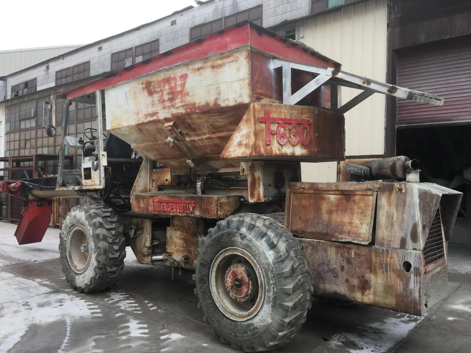 Tuckerbilt T-630 concrete buggy before restoration, heavily rusted